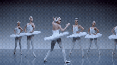 Ballerinas In White Tutus Dancing On Stage GIF