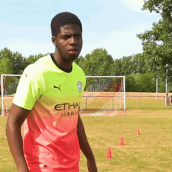 Balogun Looking At Two Hands GIF