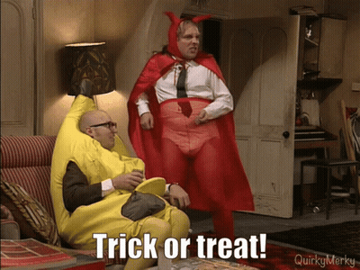 Banana Costume Man Sitting Next To Red Cape Man Saying Trick Or Treat GIF