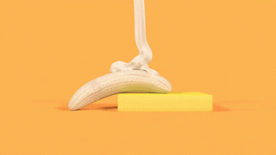 Banana Sitting On Yellow Square GIF