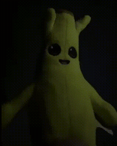 Banana Stuffed Animal With Big Eyes Glowing In Dark GIF