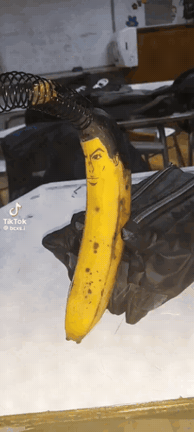 Banana With Painted Face Sitting GIF