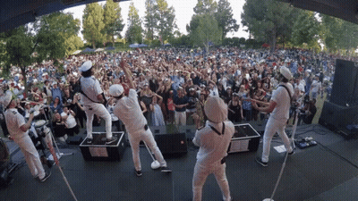 Band Performing On Stage Before Crowd GIF