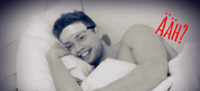 Bandaged Man Laying In Bed Saying Aah GIF