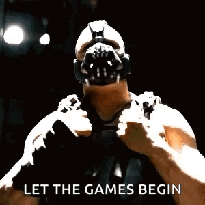 Bane From The Dark Knight Rises Is Wearing A Gas Mask And Pointing . GIF