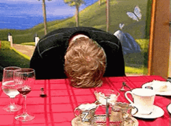 Banging Head On Desk On A Dinner GIF