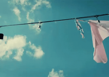 Banner Hanging On Clothesline GIF