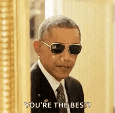 Barack Obama In Sunglasses And Suit In Front Of Picture Frame GIF