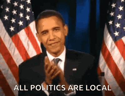 Barack Obama Is Applauding In Front Of An American Flag And Says All Politics Are Local . GIF