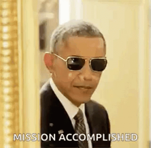 Barack Obama Is Wearing Sunglasses And A Suit And Tie While Peeking Out Of A Doorway . GIF