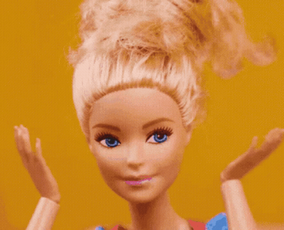 Barbie Doll Close Up With Blue Eyes And Blonde Hair GIF