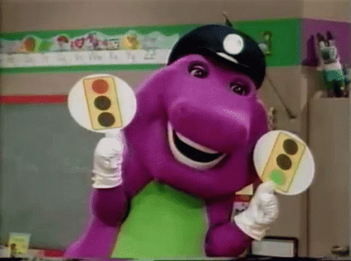 Barney The Dinosaur Is Wearing A Police Hat And Holding Two Traffic Lights In His Hands . GIF