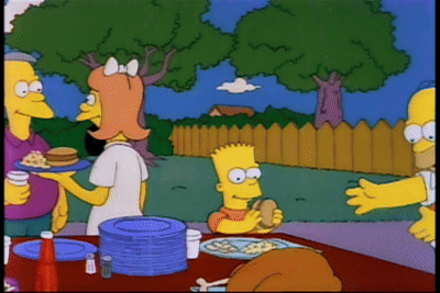 Bart Simpson And Homer Simpson Are Sitting At A Table With Plates And A Turkey GIF