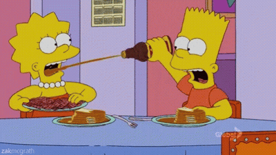 bart simpson and lisa simpson are sitting at a table eating pancakes