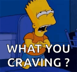 Bart Simpson From The Simpsons Is Standing In A Dark Room With His Mouth Open And Says `` What You Craving ? '' GIF