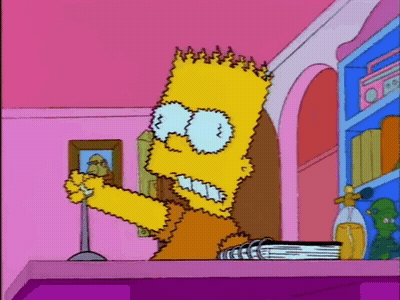 Bart Simpson Sitting On Purple Table Holding Book GIF