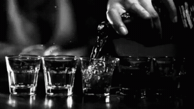 Bartender Pouring Liquor Into Shot Glasses GIF