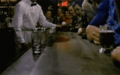 Bartender Serving Drink To Group GIF