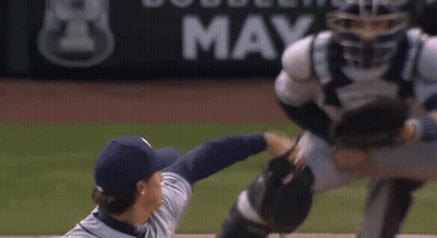Baseball Catcher Trying To Catch Ball In Front Of Bobblehead May Sign GIF