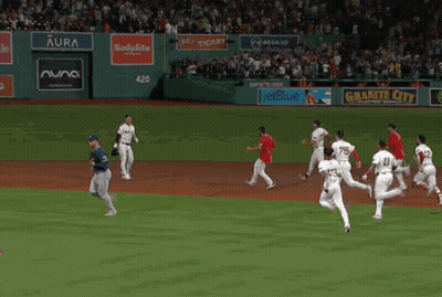 Baseball Game in Front of Aura Banner