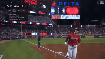 Baseball Game In Front Of Coca Cola And Delta Signs GIF