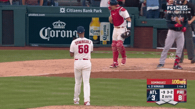 Baseball Game In Front Of Corona Ad GIF