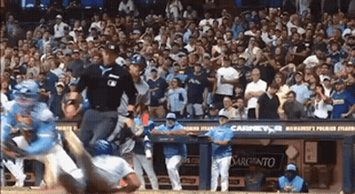 Baseball Game In Front Of Crowd With Casino Sign GIF