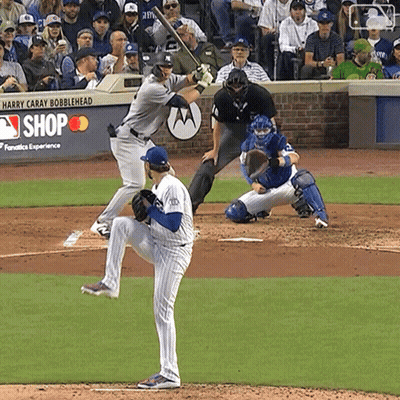 Baseball Game In Front Of Harry Caray Bobblehead Sign GIF