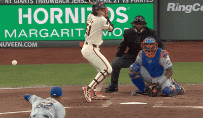 Baseball Game In Front Of Hornitos Sign GIF