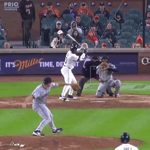 Baseball Game In Front Of Miller Beer Ad GIF