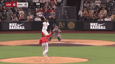 Baseball Game In Front Of Nike Sign GIF