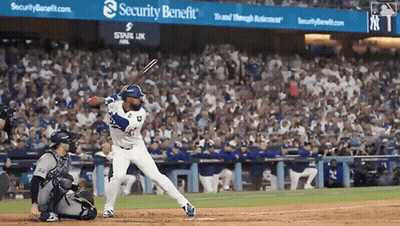 Baseball Game In Front Of Security Benefit Sign GIF