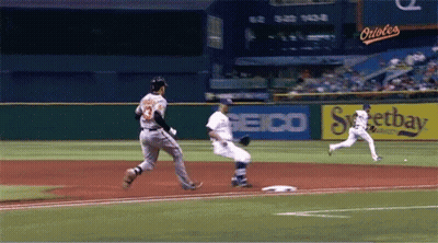 Baseball Game In Front Of Seico Ad GIF