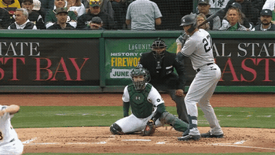 Baseball Game In Front Of Tate St Bay Sign GIF
