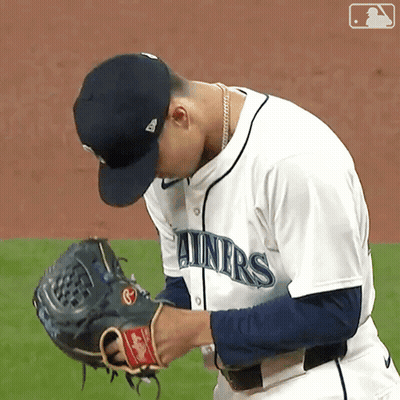 Baseball Player Adjusting Glove