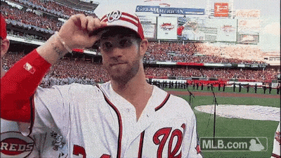 Baseball Player Adjusting Hat