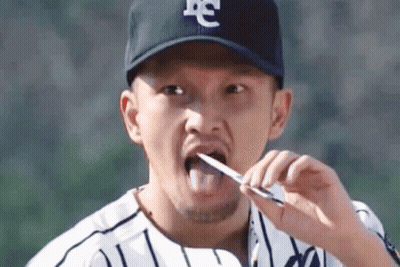 Baseball Player Brushing Teeth With Knife GIF
