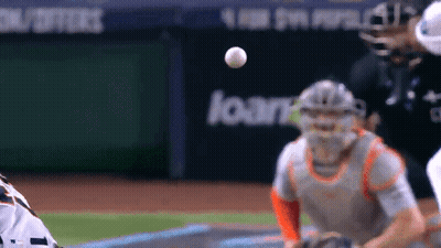 Baseball Player Catching Ball In Front Of Loan Sign GIF
