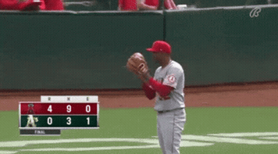 Baseball Player Catching Ball In Front Of Scoreboard A's Leading By 3 GIF