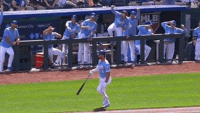 Baseball Player Holding Bat In Front Of MLB Network Dugout GIF