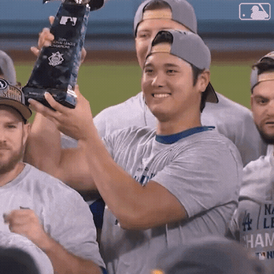 Baseball Player Holding World Series Champions Trophy GIF