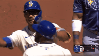 Baseball Player Hugging Teammate In Blue Helmet GIF
