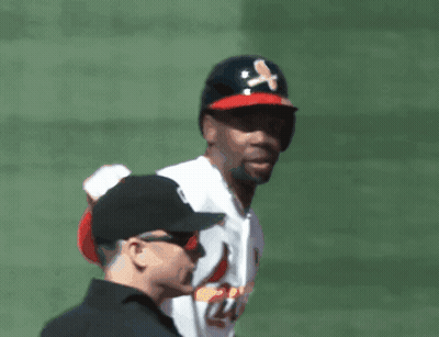 Baseball Player in Black Crossbones Hat