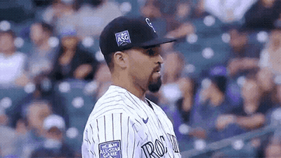 Baseball Player In Black Hat And Striped Jersey GIF