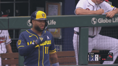 Baseball Player In Blue And Yellow Uniform Number 11 GIF