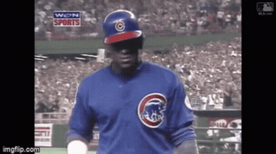 Baseball Player In Blue Cubs Jersey Stands On Field GIF