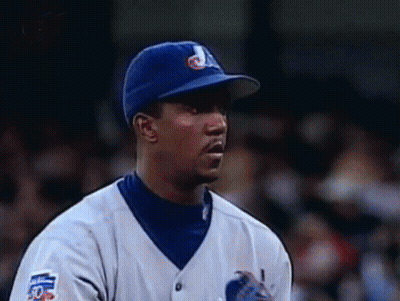 Baseball Player In Blue Hat And White Jersey Number 50 GIF