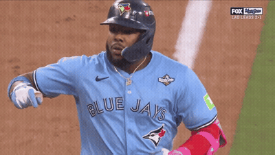 Jugador de béisbol con camiseta de los Blue Jays señalando GIF