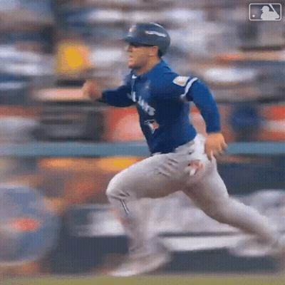 Baseball Player in Blue Jays Jersey Running