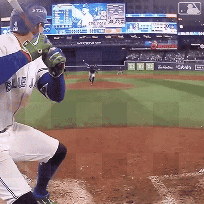 Baseball Player In Blue Jersey About To Swing Bat GIF